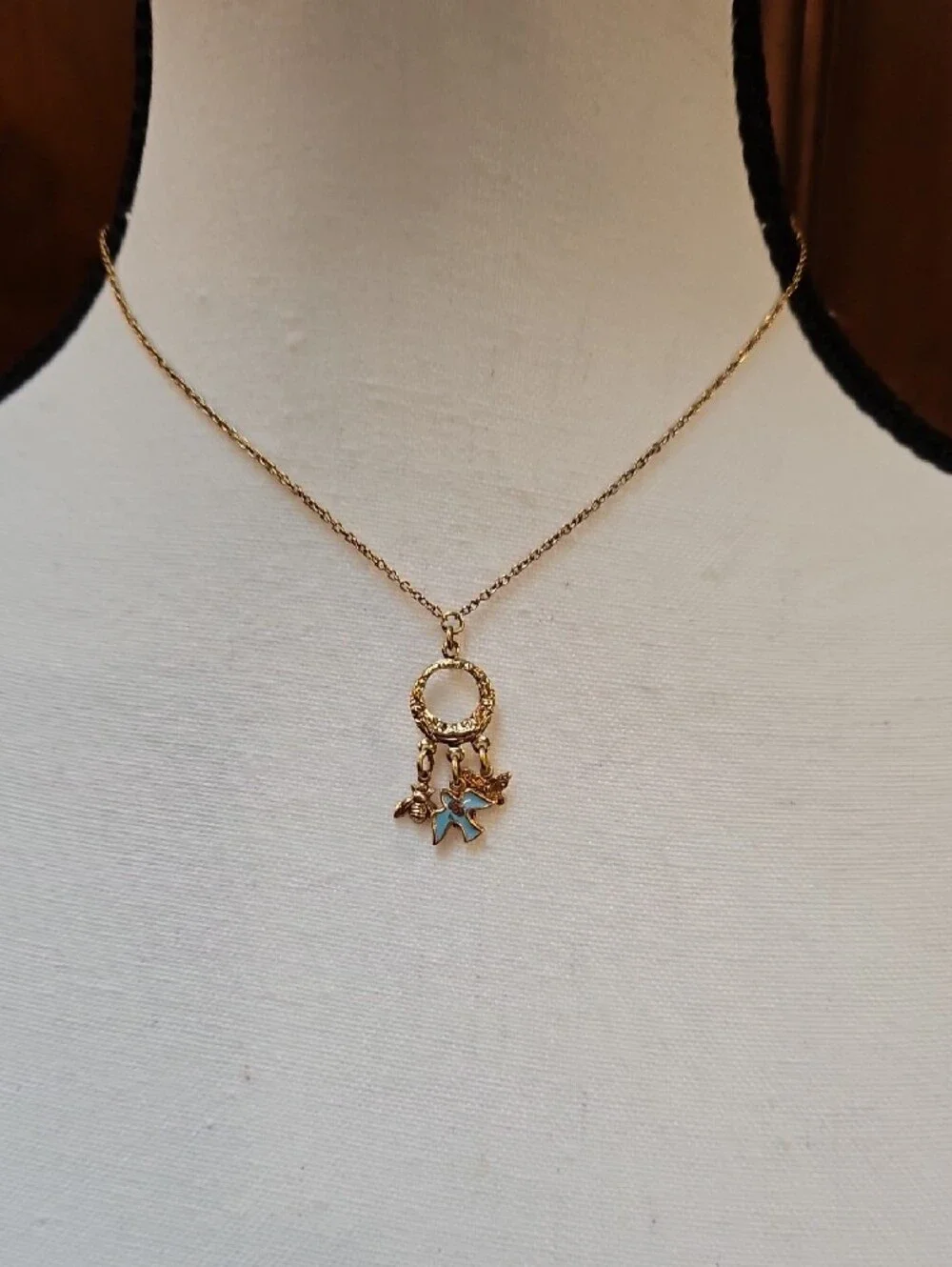 1928 Gold-Tone Circle Necklace with Blue Enamel Bird Bee Butterfly Charms
